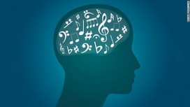 a silhouette of a man with music symbols where the brain is