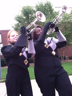 Me and my Friend Kayla Modeling with our Trumpets in our marching band uniforms
